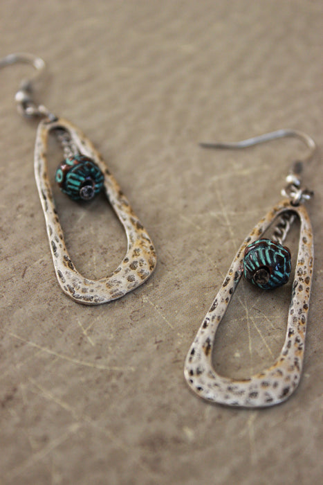 Hammered Open Oval And Dangling Ball Earring